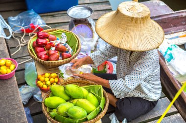 Floating market in Thailand in a summer day clipart