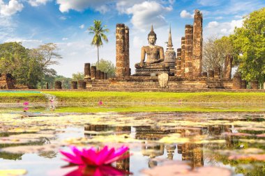 Wat Mahathat Temple in Sukhothai historical park, Thailand in a summer day clipart