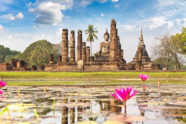 Wat Mahathat Temple in Sukhothai historical park, Thailand in a summer day clipart