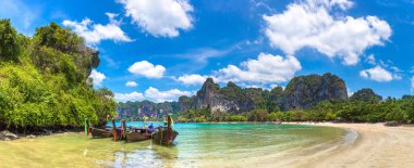 Panorama of Traditional long tail boat on Railay Beach, Krabi, Thailand in a summer day clipart