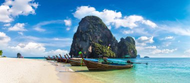 Panorama of  Traditional long tail boat on Ao Phra Nang Beach, Krabi, Thailand in a summer day clipart