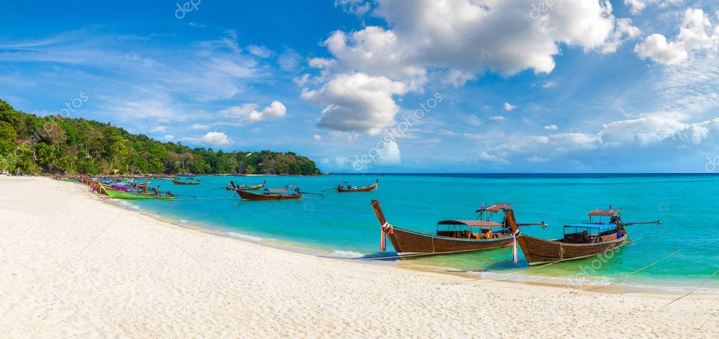 Panorama of Traditional thai longtail boat at Log Dalum Beach on Phi Phi Don island, Thailand in a summer day