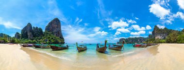 Panorama of Traditional long tail boat on Railay Beach, Krabi, Thailand in a summer day clipart