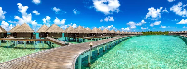 Panorama of Water Villas (Bungalows) at Tropical beach in the Maldives at summer day