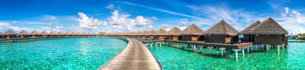 Panorama of Water Villas (Bungalows) at Tropical beach in the Maldives at summer day