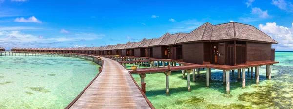 Panorama of Water Villas (Bungalows) at Tropical beach in the Maldives at summer day