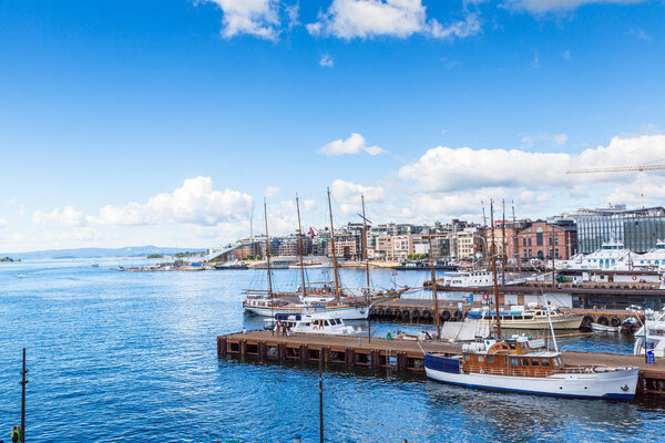 OSLO, NORWAY - JULY 29, 2014:  The Oslo Norway Harbor is one of Oslo's great attractions. Situated on the Oslo Fjord in Oslo, Norway in a summer day