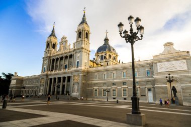 MADRID, SPAIN - JULY 11, 2014:  Almudena cathedral in Madrid in a beautiful summer day, Spain clipart