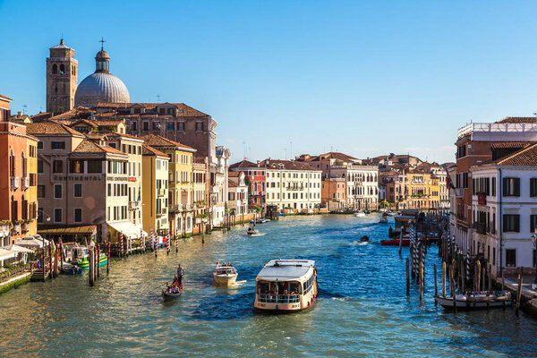 VENICE, ITALY - JUNE 18, 2014: Gondola on Canal Grande in Venice, in a beautiful summer day in Italy on June 18