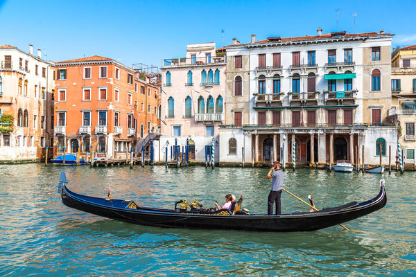 VENICE, ITALY - JUNE 18, 2014: Gondola on Canal Grande in Venice, in a beautiful summer day in Italy on June 18