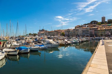 CANNES, FRANCE - JUNE 23, 2016: Yachts anchored in port in Cannes in a beautiful summer day, France on June 23, 2016 clipart