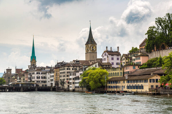 ZURICH, SWITZERLAND - JUNE 27, 2016: Clock tower of the Fraumunster cathedral in historical part of Zurich in a beautiful summer day, Switzerland