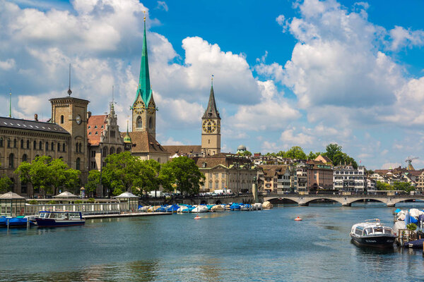 ZURICH, SWITZERLAND - JUNE 27, 2016: Clock tower of the Fraumunster Cathedral in historical part of Zurich in a beautiful summer day, Switzerland