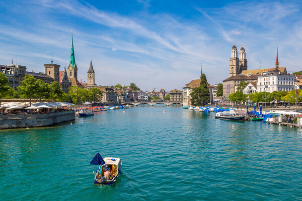 ZURICH, SWITZERLAND - JULY 25, 2017: Historical part of Zurich with famous Fraumunster and Grossmunster churches in a beautiful summer day, Switzerland