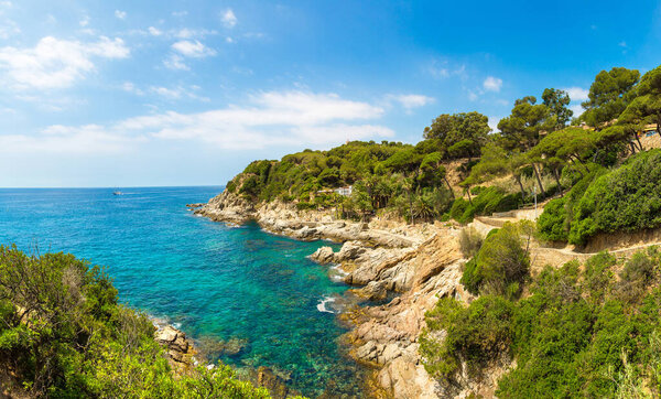 Panorama of Rocks on the coast of Lloret de Mar in a beautiful summer day, Costa Brava,