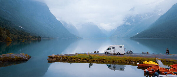 Family vacation travel RV, holiday trip in motorhome, Caravan car Vacation. Beautiful Nature Norway natural landscape.