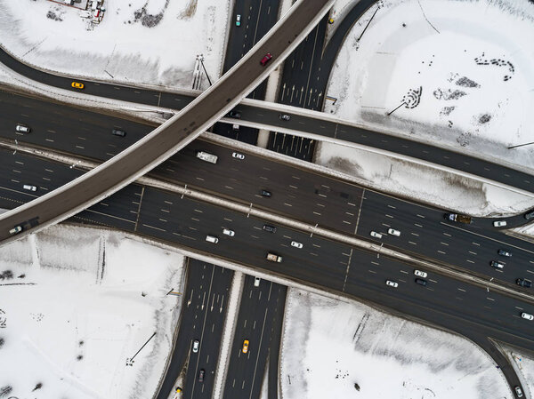 Aerial view of a freeway intersection Snow-covered in winter.