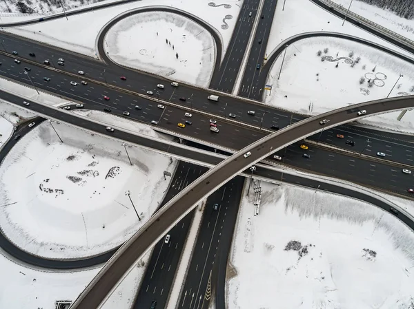 Aerial view of a freeway intersection Snow-covered in winter.