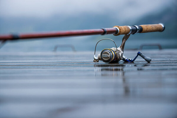 Fishing rod spinning blurred background