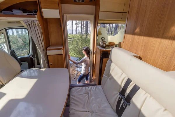 Woman in the interior of a camper RV motorhome with a cup of cof — Stock Photo, Image