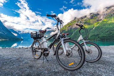 Electric bicycle on the background of nature Norway clipart