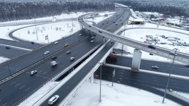 Aerial view of a freeway intersection Snow-covered in winter. — Stock Video