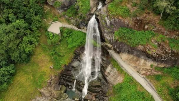 Steinsdalsfossen is a waterfall in the village of Steine in the municipality of Kvam in Hordaland county, Norway. The waterfall is one of the most visited tourist sites in Norway. — Stock Video
