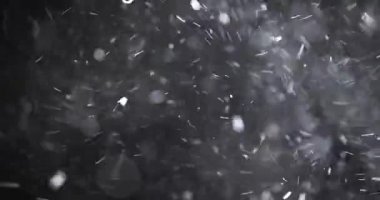 Karanlık arkaplanda soyut parçacık bokeh 'i yüzdürür