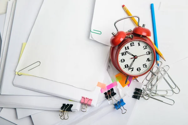 Alarm clock, over pile various documents Deadline business and f — Stock Photo, Image