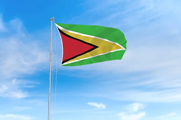 Guyana vlag over blauwe hemel achtergrond — Stockfoto