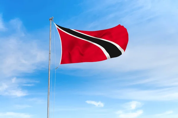 Trinidad and Tobago flag over blue sky background — Stockfoto