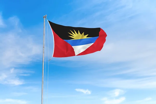 Antigua en Barbuda vlag over blauwe hemel achtergrond — Stockfoto