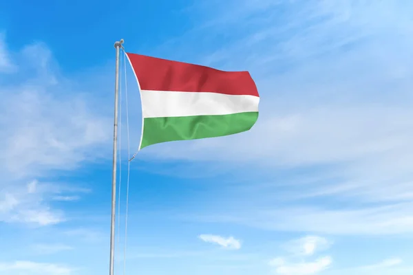 Hungary flag over blue sky background