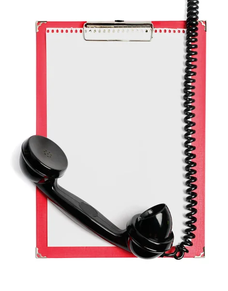 Clipboard with paper and vintage phone receiver — Stock Photo, Image