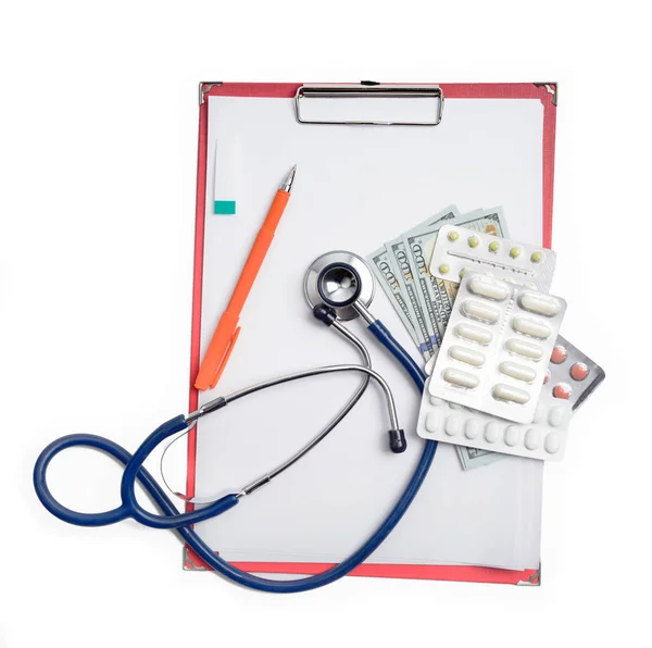 Clipboard with stethoscope, pen, dollar, money and drag pills. — Stock Photo, Image