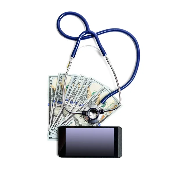 Stethoscope on dollar bills and mobile phone — Stock Photo, Image