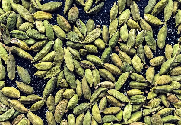 Zielone tło nasion kardamon — Zdjęcie stockowe