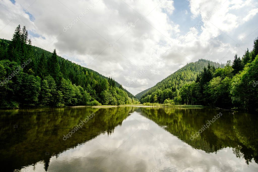 lake in the wooded mountains of the Ukrainian Carpathians in Europe