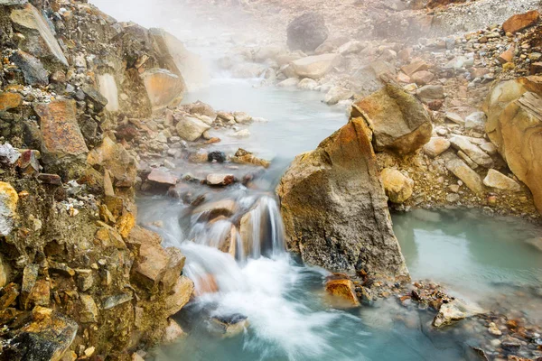 water flow among stones, long exposure, bright colors, beautiful background
