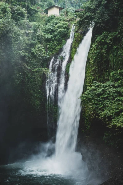 waterfall on the island, beautiful tropical hawaiian island, vertical photo, nature, travel bali