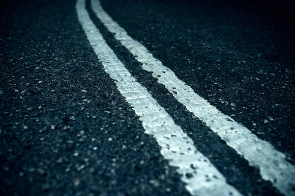 Double solid on asphalt — Stock Photo, Image