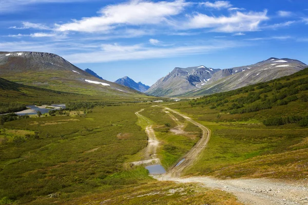 Summer landscape with mountains and road in the tundra, Yamal, Russia