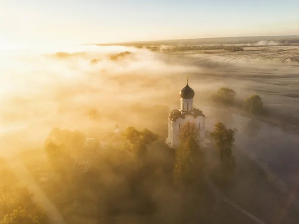 Church of Intercession upon Nerl River. (Bogolubovo, Vladimir region, Golden Ring of Russia) in autumn morning. Aerial photo — Stock Image Church Intercession Nerl River Bogolubovo Vladimir Region Golden Ring Russia Stock Photo