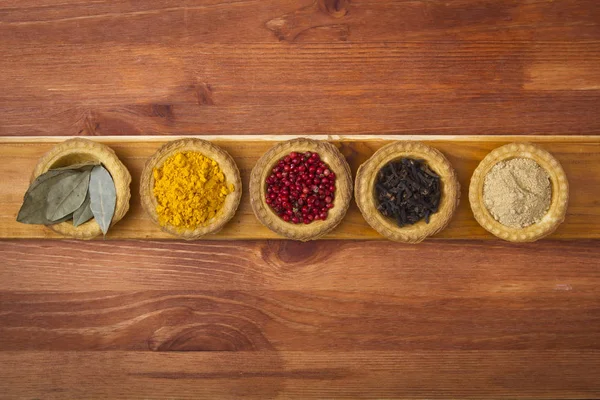 Spices Tartlets Wooden Background — Stock Photo, Image