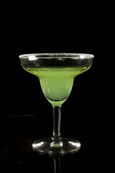 Classic Margarita Cocktail on a Black Reflective Surface