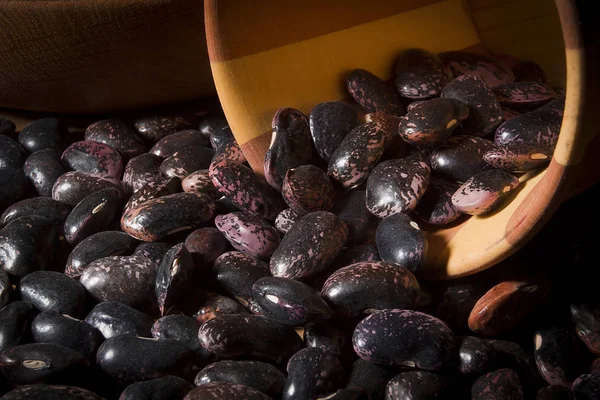 Beans in a wooden plate — Stock Photo, Image