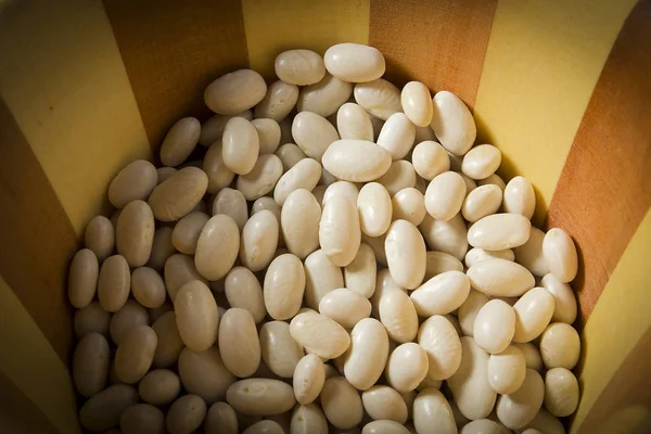 Beans in a wooden plate — Stock Photo, Image