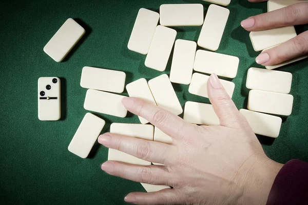 Hands mixing dominoes — Stock Photo, Image