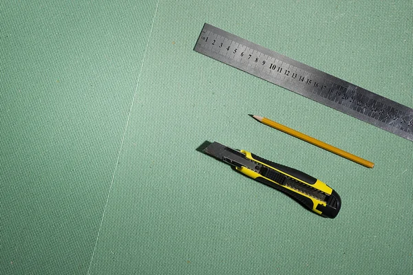 Construction knife, ruler and pencil — Stock Photo, Image