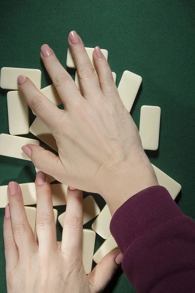 Hands mixing dominoes — Stock Photo, Image